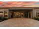 An expansive open patio offering views to the interior with beautiful pavers and twilight sky at 3045 W Feather Sound Dr, Phoenix, AZ 85086