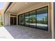 Covered patio features tile flooring and retractable glass doors offering seamless indoor-outdoor living at 3045 W Feather Sound Dr, Phoenix, AZ 85086