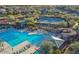 Aerial view of community pool, tennis courts, and lounge areas; a relaxing recreational oasis at 3045 W Feather Sound Dr, Phoenix, AZ 85086