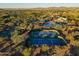 Aerial shot featuring tennis courts, a pool, and community spaces surrounded by desert landscape and distant mountains at 3045 W Feather Sound Dr, Phoenix, AZ 85086