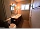 Bathroom with updated vanity, toilet and towel rack at 3216 E Campo Bello Dr, Phoenix, AZ 85032