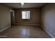 Bedroom with tile floors, a window, and neutral paint at 3216 E Campo Bello Dr, Phoenix, AZ 85032