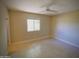 Bedroom with tile floors and a window at 3216 E Campo Bello Dr, Phoenix, AZ 85032