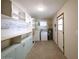 Functional garage interior with laundry area, storage and exterior door, designed for practical living at 3216 E Campo Bello Dr, Phoenix, AZ 85032