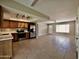 A bright kitchen with wood cabinets, stainless steel appliances, and tiled floor at 3216 E Campo Bello Dr, Phoenix, AZ 85032