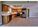 Well-lit kitchen boasting stainless steel appliances and ample counter space for cooking at 3216 E Campo Bello Dr, Phoenix, AZ 85032