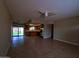 View of the open living area flowing seamlessly into the kitchen with modern appliances at 3216 E Campo Bello Dr, Phoenix, AZ 85032