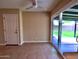 A spacious living room featuring sliding glass doors to the backyard and a ceiling fan at 3216 E Campo Bello Dr, Phoenix, AZ 85032