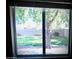 Large window with a view of the fenced backyard and mature tree at 3216 E Campo Bello Dr, Phoenix, AZ 85032