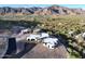 Stunning aerial view of a modern home nestled in a desert landscape with mountain views at 3502 S Kings Ranch Rd, Gold Canyon, AZ 85118