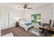 Bedroom with a bed, large window, desk, ceiling fan, and closet at 3750 E Palm St, Mesa, AZ 85215
