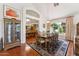 Formal dining area with hardwood floors, elegant chandelier, and seating for eight at 3750 E Palm St, Mesa, AZ 85215