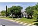 Charming single-story home with lush green lawn, mature trees, and inviting walkway at 3750 E Palm St, Mesa, AZ 85215