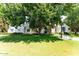 Beautiful home with a lush green lawn, mature trees, and manicured landscaping in the front yard at 3750 E Palm St, Mesa, AZ 85215