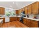 Kitchen with wooden cabinets, white countertops, stainless appliances, and tile backsplash at 3750 E Palm St, Mesa, AZ 85215