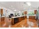 Spacious kitchen with a large island, white countertops, stainless steel oven and wood cabinets at 3750 E Palm St, Mesa, AZ 85215