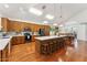 Bright and spacious kitchen with a large island, stainless steel appliances, and hardwood floors at 3750 E Palm St, Mesa, AZ 85215