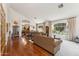 Bright living room with hardwood floors, large windows, and elegant furnishings at 3750 E Palm St, Mesa, AZ 85215