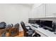 Home office with built-in desk, cabinets, and a comfortable office chair at 3750 E Palm St, Mesa, AZ 85215