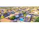 Home's aerial view showcasing a sparkling pool, outdoor living space, and lush landscaping at 4049 E Arbor Ave, Mesa, AZ 85206