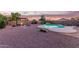 An outdoor backyard features a pool, fire pit and desert landscaping at 4049 E Arbor Ave, Mesa, AZ 85206