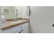 Well-lit half bathroom with granite countertop and modern fixtures at 4049 E Arbor Ave, Mesa, AZ 85206
