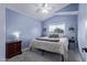 This bedroom includes a ceiling fan, a large bed and a dresser at 4049 E Arbor Ave, Mesa, AZ 85206