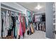 Organized walk-in closet with ample storage for clothing and accessories at 4049 E Arbor Ave, Mesa, AZ 85206