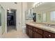 Dual sink vanity in the main bathroom with ample lighting and cabinet space at 4049 E Arbor Ave, Mesa, AZ 85206