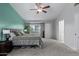 Spacious main bedroom with a ceiling fan, comfortable carpet, and natural light at 4049 E Arbor Ave, Mesa, AZ 85206