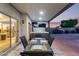 Relax at the patio with a table set, sliding glass doors and a hot tub in the backyard at 4049 E Arbor Ave, Mesa, AZ 85206