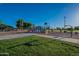Community playground featuring swings, slides and ample space for recreation at 4049 E Arbor Ave, Mesa, AZ 85206