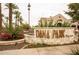 Street view of community shopping center with brick signage and flowering bushes at 4049 E Arbor Ave, Mesa, AZ 85206