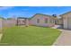 Lush green backyard features pergola, fire pit, and patio at 4112 N 4Th Ave, Phoenix, AZ 85013
