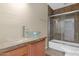 Bathroom with glass vessel sink, granite countertop and tub-shower combination at 4112 N 4Th Ave, Phoenix, AZ 85013