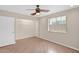 Light and bright bedroom with ceiling fan, hardwood floors, and open closet space at 4112 N 4Th Ave, Phoenix, AZ 85013