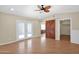 Bedroom with a ceiling fan, French doors to outside, and a barn door into the closet at 4112 N 4Th Ave, Phoenix, AZ 85013
