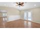 Bright bedroom featuring wood floors, ceiling fan, and access to the outdoor patio at 4112 N 4Th Ave, Phoenix, AZ 85013