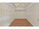 Walk-in closet with a shelving system to keep your wardrobe organized and easily accessible at 4112 N 4Th Ave, Phoenix, AZ 85013