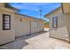 Side exterior view showcasing stucco walls and a door leading to the interior of the property at 4112 N 4Th Ave, Phoenix, AZ 85013