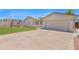 Exterior showcasing a 2-car garage, grassy backyard, and a concrete driveway at 4112 N 4Th Ave, Phoenix, AZ 85013