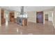 Modern kitchen featuring stainless steel appliances, tile countertops, pendant lights, and a barn door at 4112 N 4Th Ave, Phoenix, AZ 85013