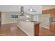 Open kitchen layout with granite countertops, central island, and a seamless flow to the living area at 4112 N 4Th Ave, Phoenix, AZ 85013