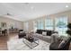 Staged living room with ample seating, plush rug, modern furnishings, and plenty of natural light at 4112 N 4Th Ave, Phoenix, AZ 85013