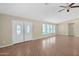 Spacious living room with new flooring, recessed lighting, ceiling fan, and double-door entry at 4112 N 4Th Ave, Phoenix, AZ 85013