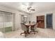 Comfortable dining area with tile flooring, ceiling fan, and natural light at 5221 E Mills Ct, Mesa, AZ 85215