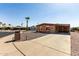 Single story home with desert landscaping and covered parking at 5221 E Mills Ct, Mesa, AZ 85215