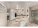 Bright kitchen with white cabinetry, a tile-topped island, and lots of natural light at 5221 E Mills Ct, Mesa, AZ 85215