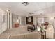 Spacious living room with ceiling fan, built-in shelving, and open layout at 5221 E Mills Ct, Mesa, AZ 85215