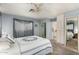Bright main bedroom with ensuite bathroom and closet with mirrored doors at 5221 E Mills Ct, Mesa, AZ 85215